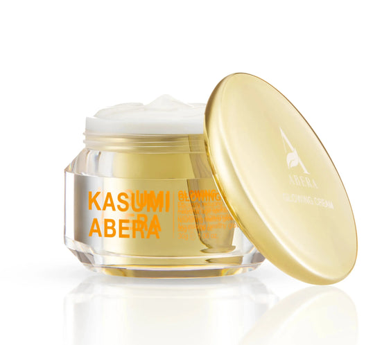 Cosmetic jar with gold lid and 'Kasumi Abera' text on a white background